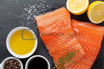 Salmon and spices on stone table