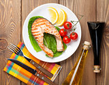 Grilled salmon, salad and condiments