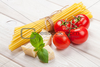 Italian food cooking ingredients. Pasta, tomatoes, basil