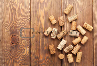 Wine corks over rustic wooden table background