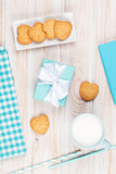 Cup of milk, heart shaped cookies, gift box and notepad