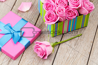 Valentines day card with gift box full of pink roses