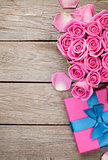 Valentines day background with gift box full of pink roses