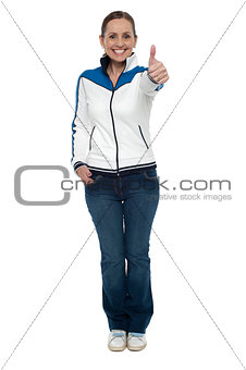 Casual charming woman gesturing thumbs up