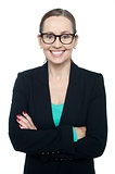 Bespectacled woman posing confidently