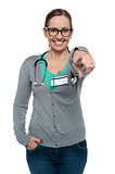 Cheerful medical practitioner pointing at the camera