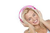 Tilted shot of a blonde engrossed in music
