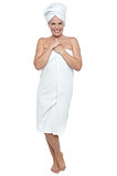 Full length portrait of a woman wrapped in towel