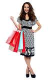 Shopping woman happy smiling carrying bags
