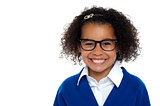 Bespectacled primary girl on a white background