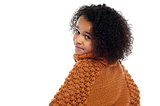 Little girl with over sized sweater on turning back