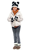 Little fashionable girl in warm clothes