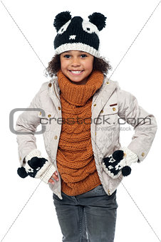 Cute little girl in fashionable warm winter clothes