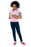 Young girl super busy in operating new tablet device