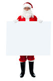 Saint Nicholas standing behind blank whiteboard