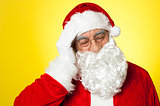Portrait of Santa Claus suffering from headache