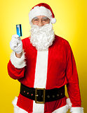 Male in Santa costume posing with his cash card