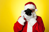 Say cheese! Santa capturing a perfect moment