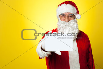 Santa holding blank white placard