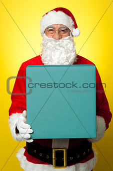 Isolated smiling Santa holding gift box
