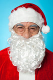 Snapshot of smiling senior man in Santa attire