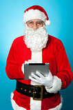 Modern Santa using digital touch screen device