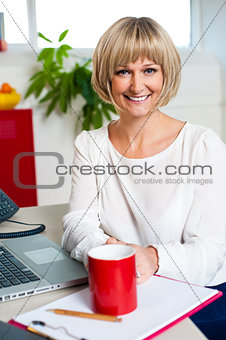 Casual blonde businesswoman in office