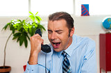 Businessman yelling during the phone call