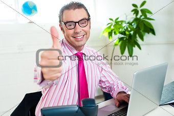 Successful entrepreneur showing thumbs up