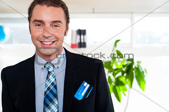 Handsome business executive smiling at the camera