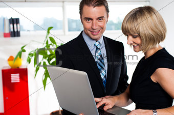 Secretary showing power point presentation to the boss