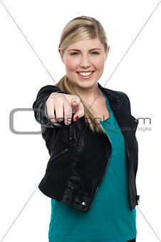 Stylish blonde teen girl pointing you out