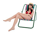 Seductive bikini woman relaxing on a deckchair