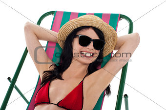 Smiling gorgeous bikini model in dark shades