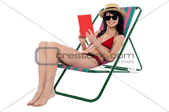 Young woman reading book and relaxing