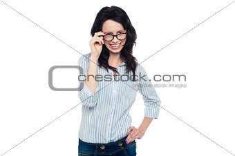 Pretty woman adjusting her spectacles