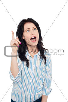 Astonished woman looking and pointing upwards
