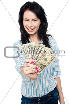 Young woman with dollars in her hands