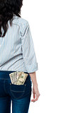 Rear view of a girl with dollars in her back pocket