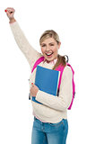 Cheerful university student raising her hand
