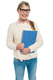 Pretty college student posing with spiral notebook