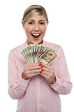 Attractive young woman holding money