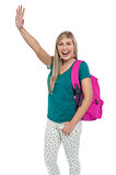 Excited college student waving her hand