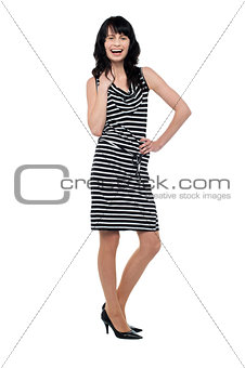Gorgeous cheerful woman striking stylish pose