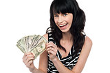 Attractive young woman holding money