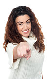 Cheerful caucasian lady pointing at you