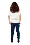 Back view of a long haired woman over white