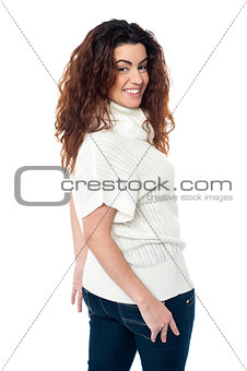 Gorgeous woman turning back and passing smile