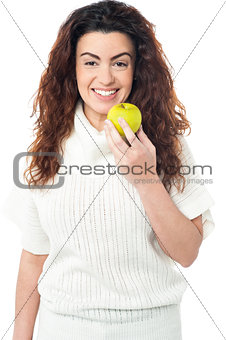 Elegant woman holding fresh green apple