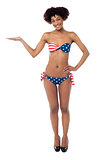 USA flag bikini model presenting copy space